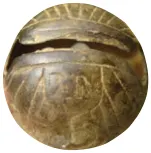 Two marked crotal bells.